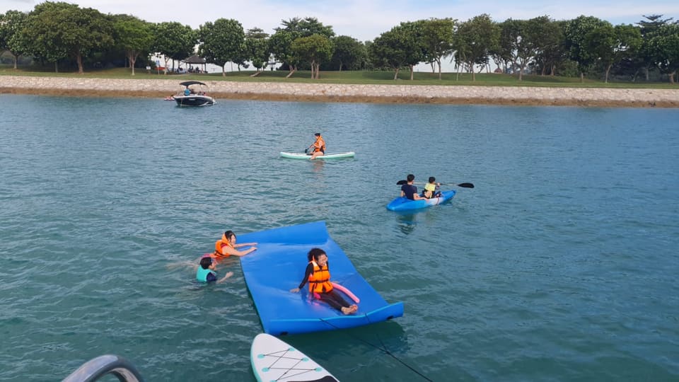 Kayak, paddleboard and the floating mat all in use at the swim stop