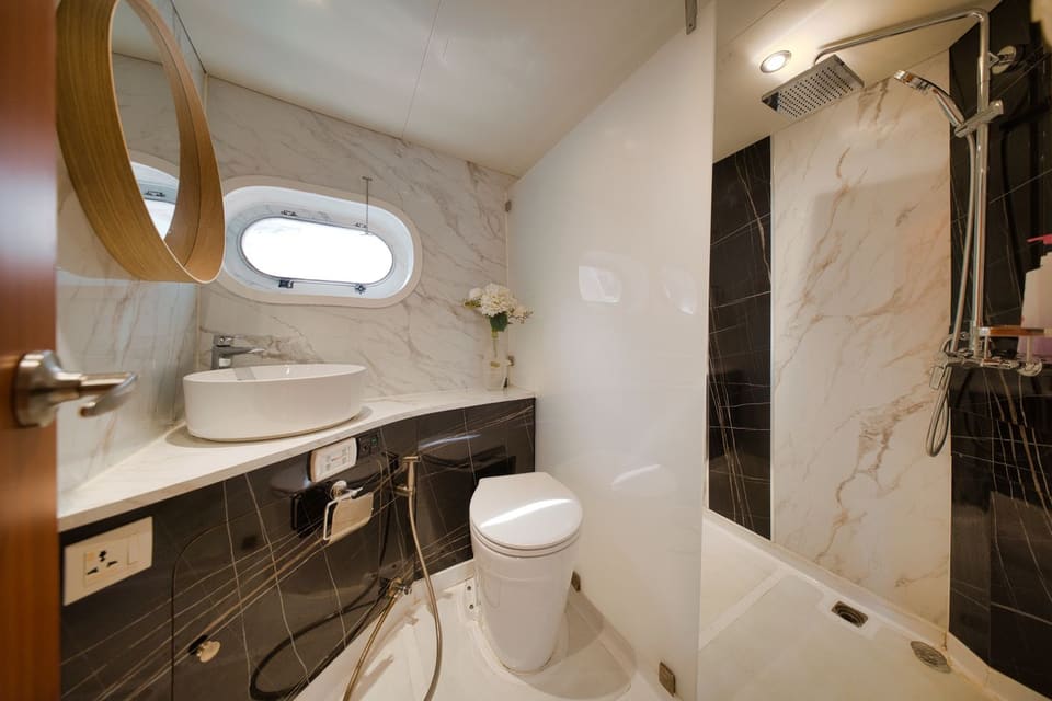Bathroom with rain shower, hand shower and a vessel sink
