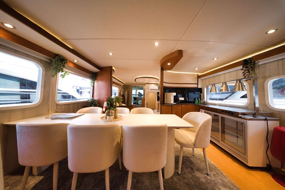 Indoor dining table for eight, beside the hot service station with warming lamps