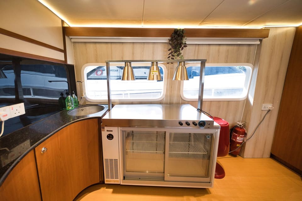 Service pantry with sink, warming cabinet and heat lamps for catering